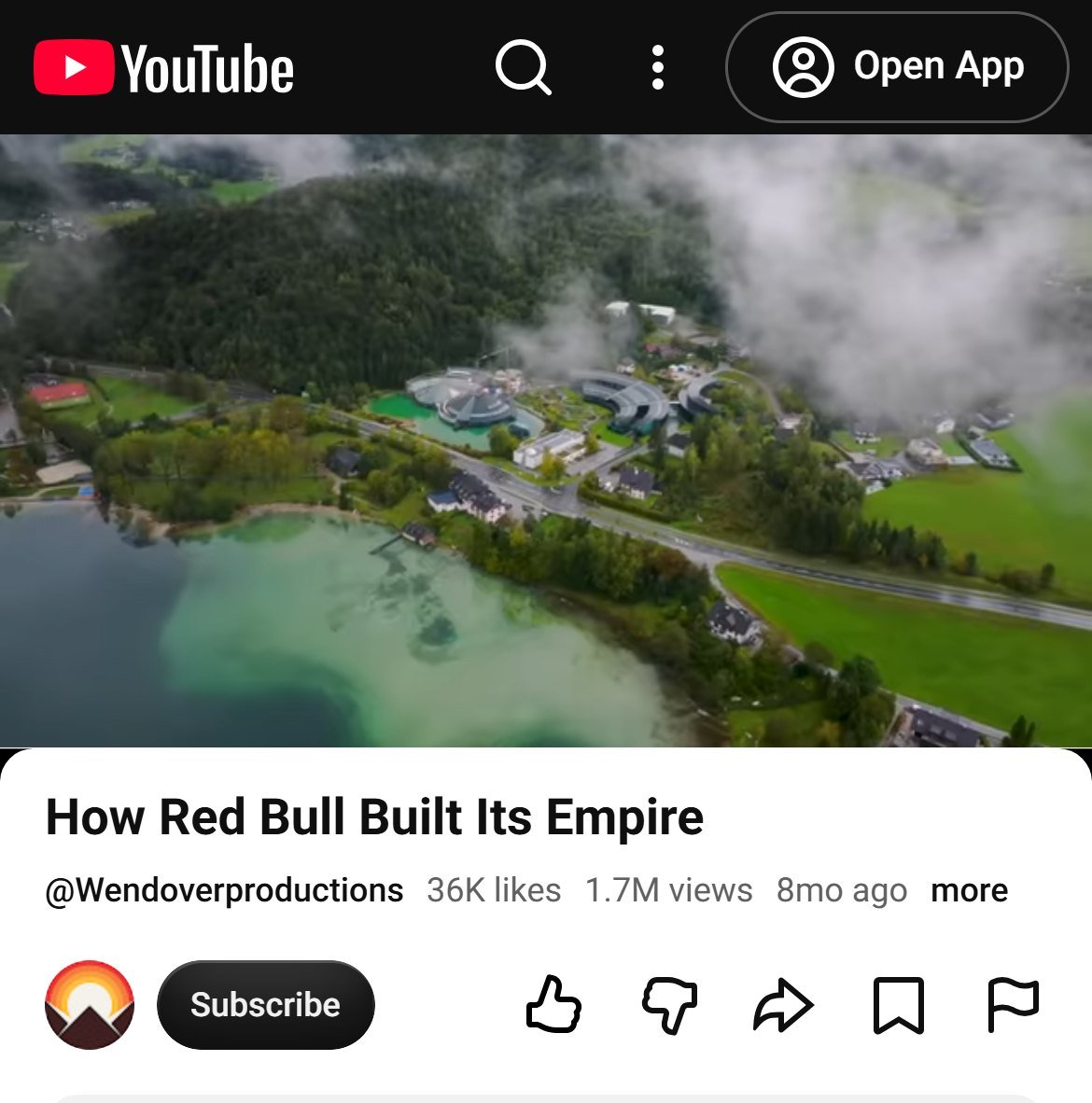 Wendover Productions video How Red Bull Built Its Empire on YouTube, 1.7 million views, paused on an aerial view of a lake town in the Austrian mountains